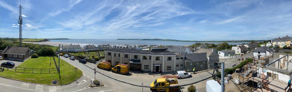 an aerial view of a town with a street and a yellow bus at Fort Conan Hotel in Duncannon