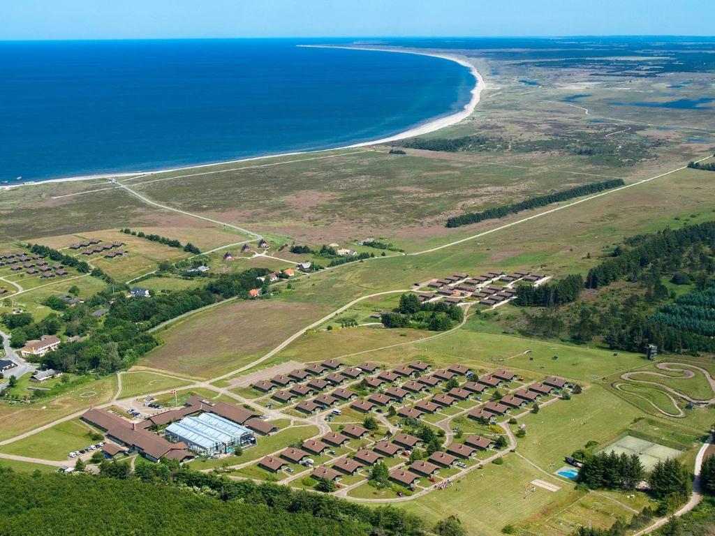 an aerial view of a resort next to the ocean at 6 person holiday home on a holiday park in Hanstholm in Hanstholm