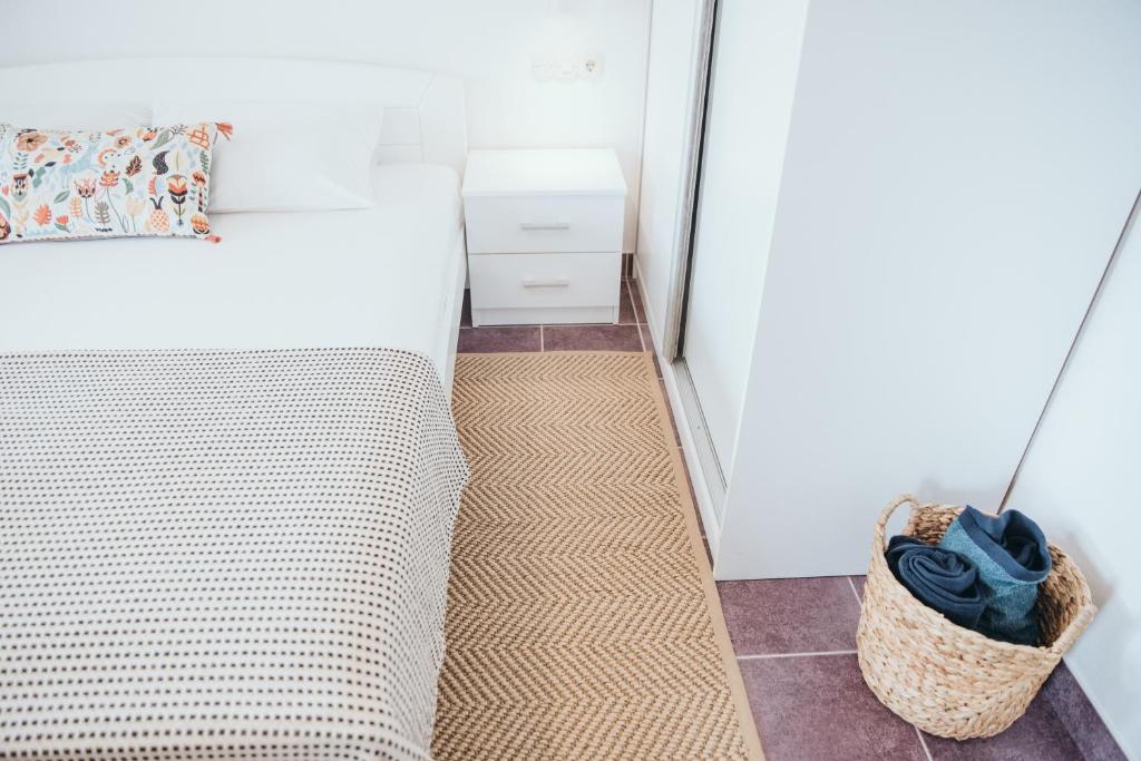 Postel nebo postele na pokoji v ubytování Anatota Hvar