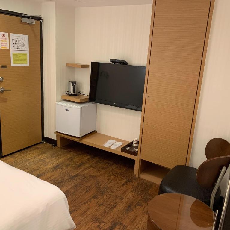 TV a/nebo společenská místnost v ubytování E-Coast Star Hotel