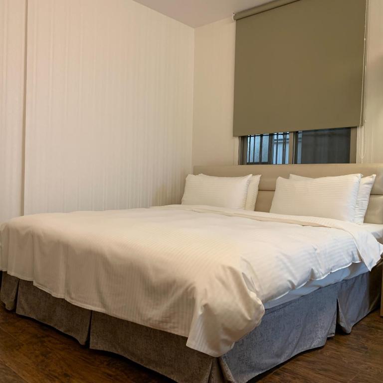 Postel nebo postele na pokoji v ubytování E-Coast Star Hotel