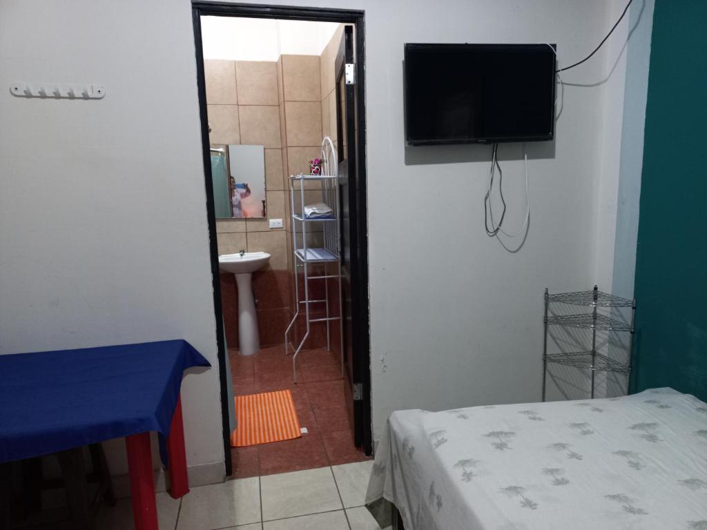 Postel nebo postele na pokoji v ubytování Hotel Trianon