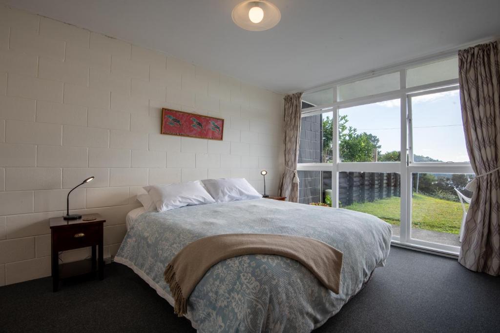 Postel nebo postele na pokoji v ubytování Mangonui Motel