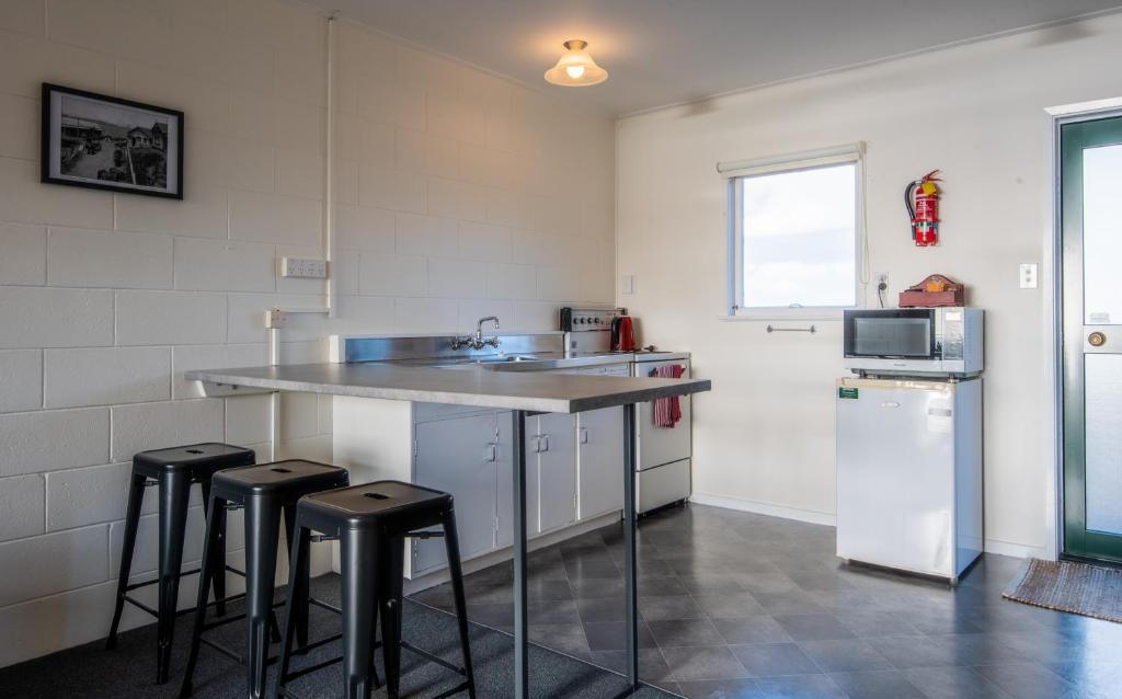Kuchyň nebo kuchyňský kout v ubytování Mangonui Motel