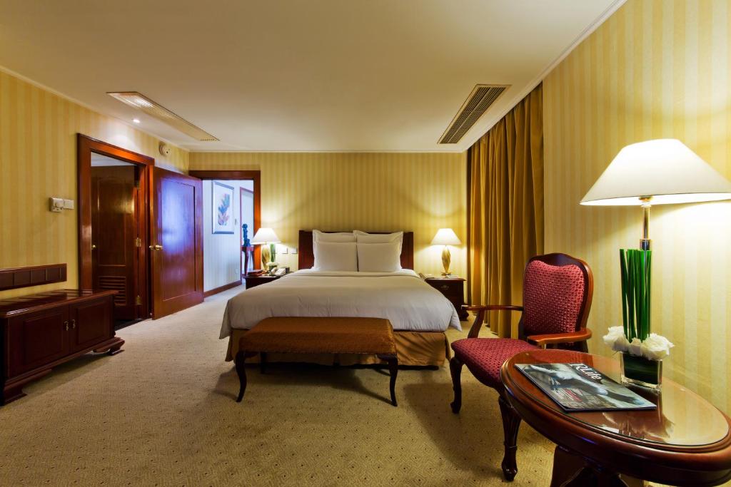 Postel nebo postele na pokoji v ubytování Clarion Hotel Tianjin