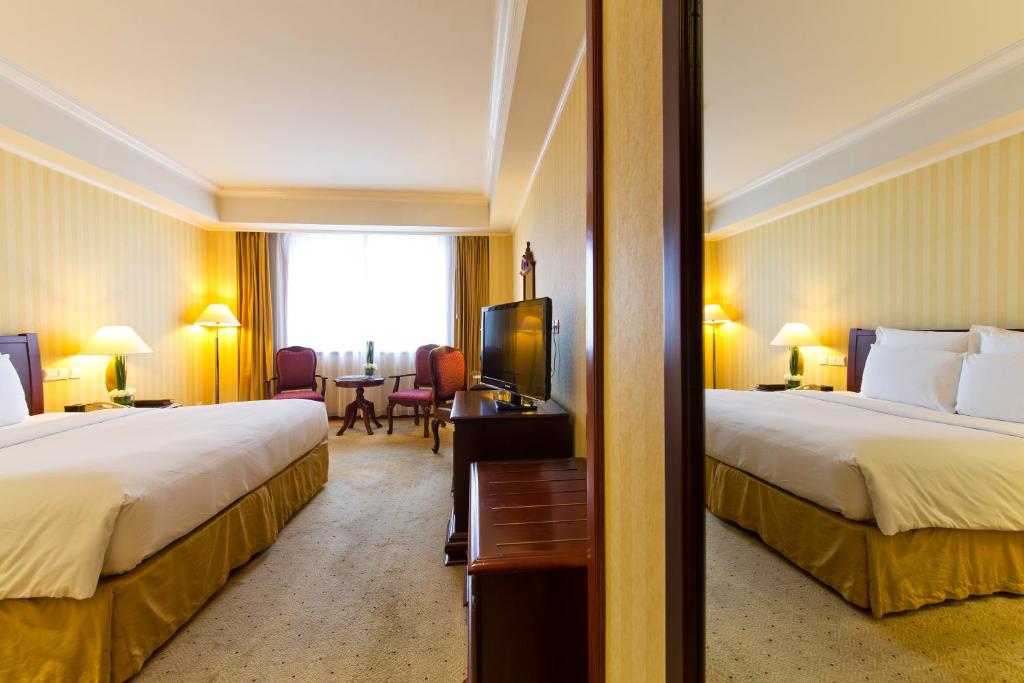 Postel nebo postele na pokoji v ubytování Clarion Hotel Tianjin