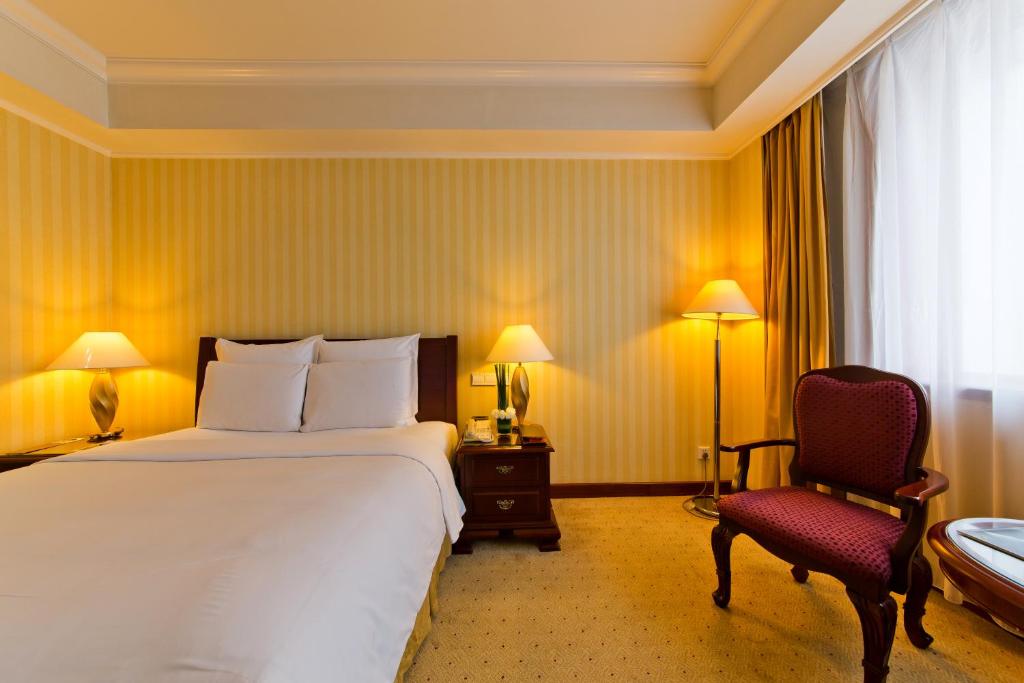 Postel nebo postele na pokoji v ubytování Clarion Hotel Tianjin
