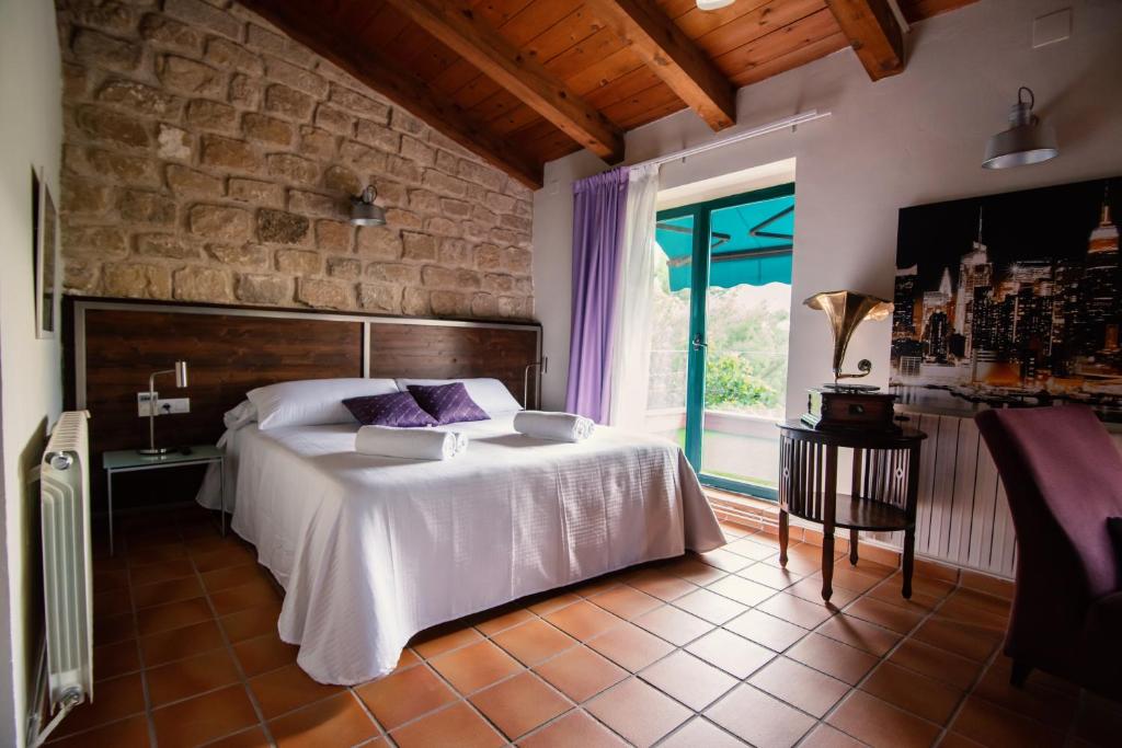 Postel nebo postele na pokoji v ubytování Hospedium Hotel La Parada del Compte