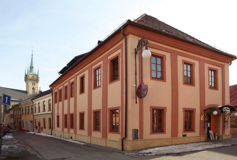 a large building on the side of a street at Penzion Otakar in Polička