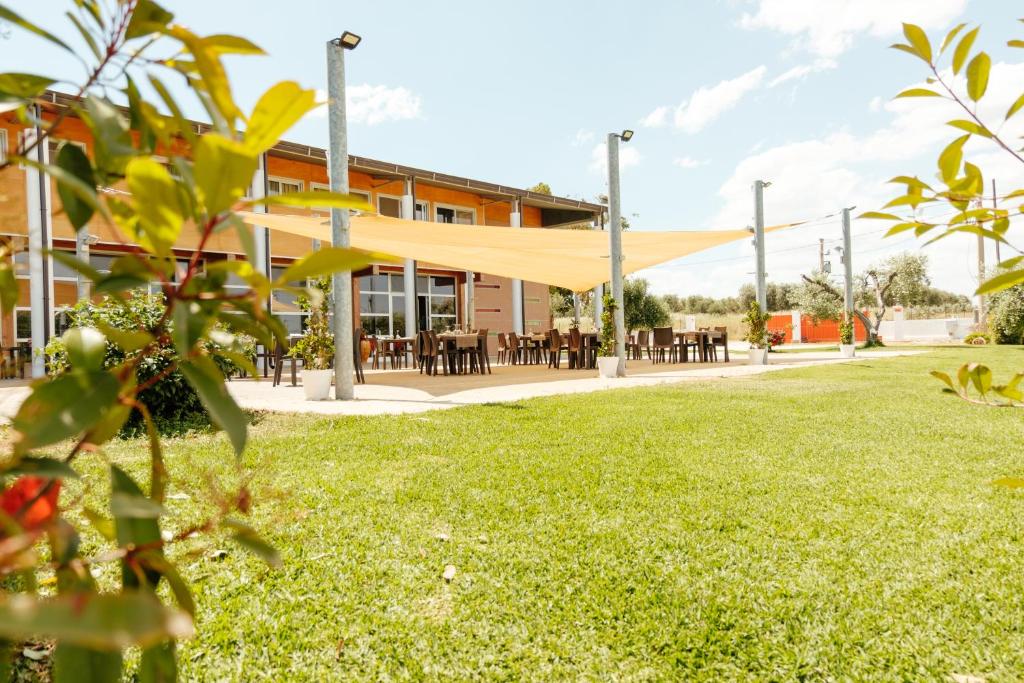 a view of the building from the park at Tocchi di Puglia in Castellaneta Marina 