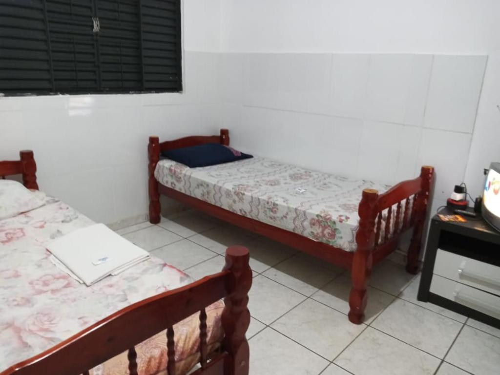 A bed or beds in a room at Hotel Palmas Tocantins
