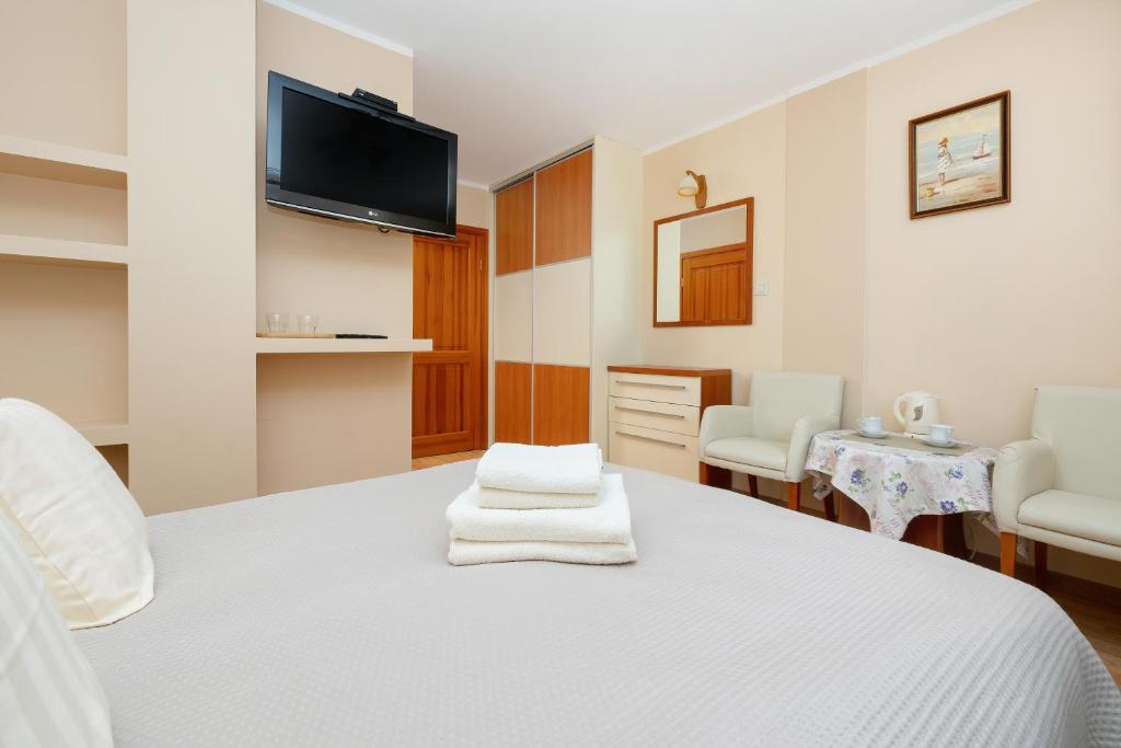 Postel nebo postele na pokoji v ubytování Willa u Wójta