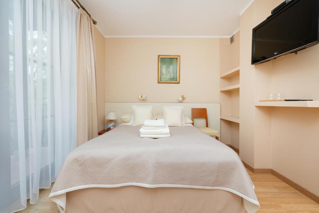 Postel nebo postele na pokoji v ubytování Willa u Wójta