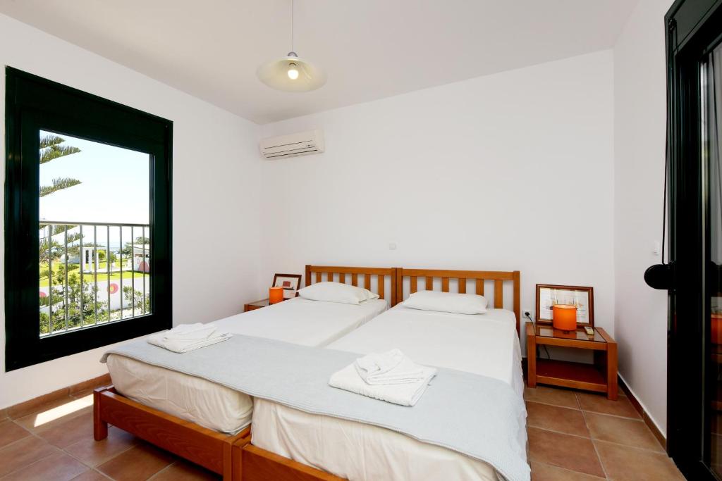 A bed or beds in a room at Seaside Villa