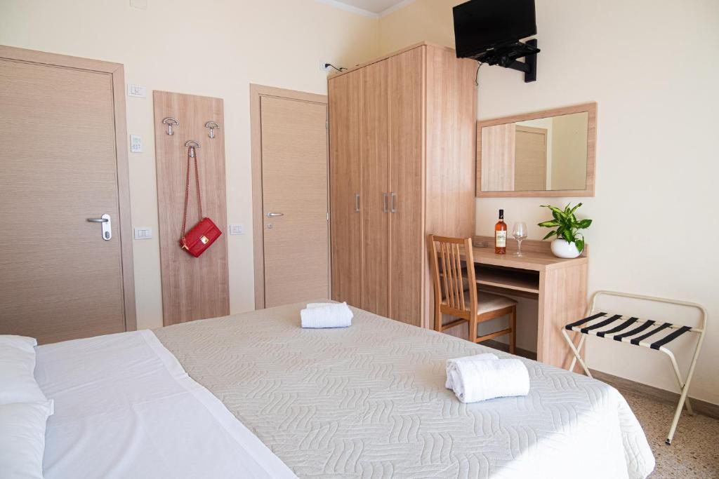 Postel nebo postele na pokoji v ubytování Hotel Cormoran Riccione