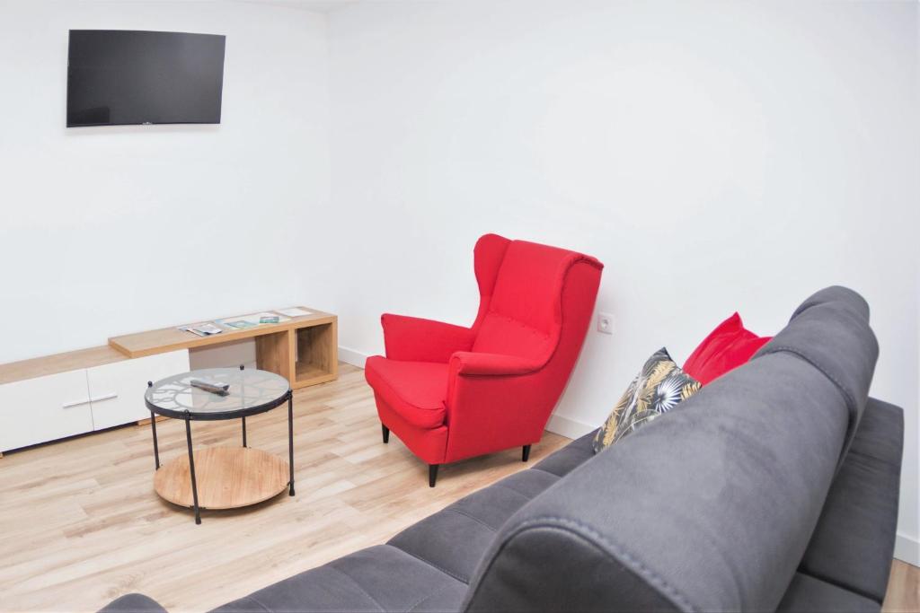TV a/nebo společenská místnost v ubytování Hospedium Apartamentos Galitrips A Casa Da Reina