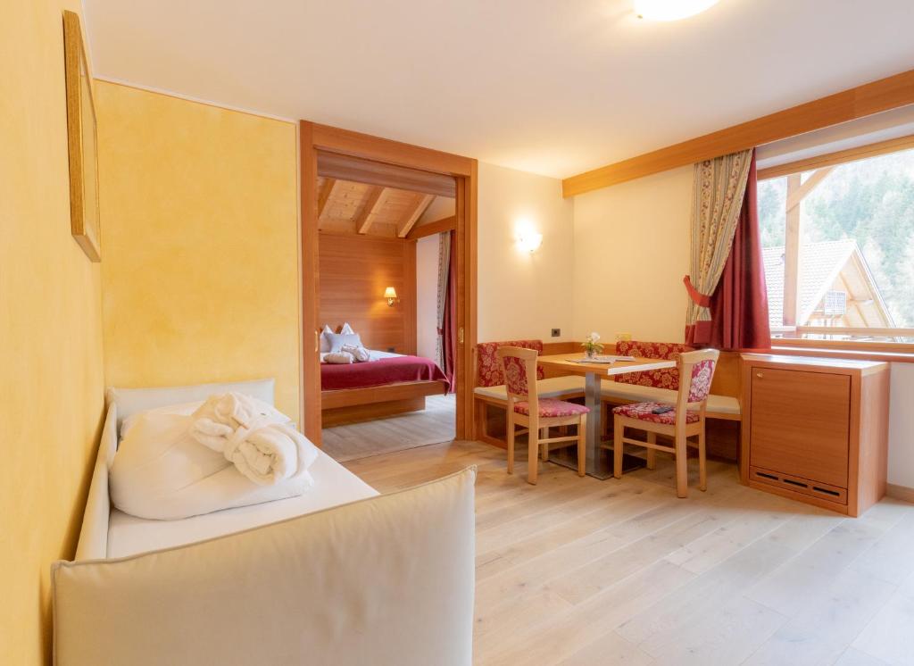 Postel nebo postele na pokoji v ubytování Berghotel Miramonti