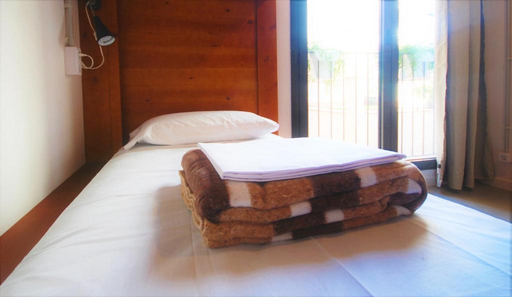 Postel nebo postele na pokoji v ubytování Ten To Go Hostel