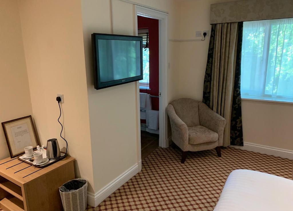 TV a/nebo společenská místnost v ubytování Haley's Hotel