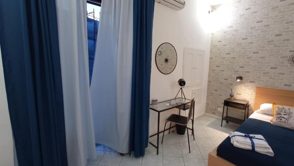 Łóżko lub łóżka w pokoju w obiekcie Casa Barocco Catania