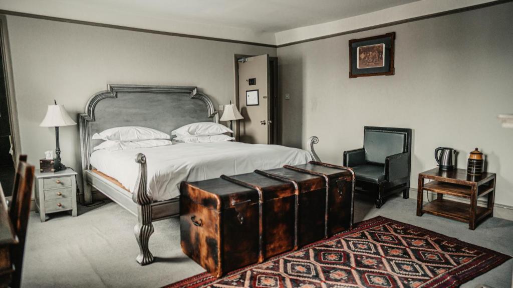 Postel nebo postele na pokoji v ubytování Elephant Hotel