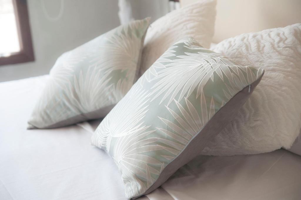 A bed or beds in a room at La Casa De Maria