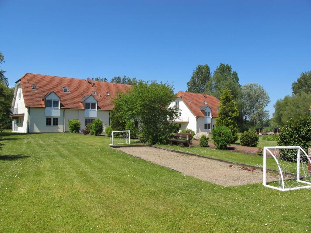 a yard with two soccer goals in the grass at Apartment Gollwitzer Park - Insel Poel-7 by Interhome in Gollwitz