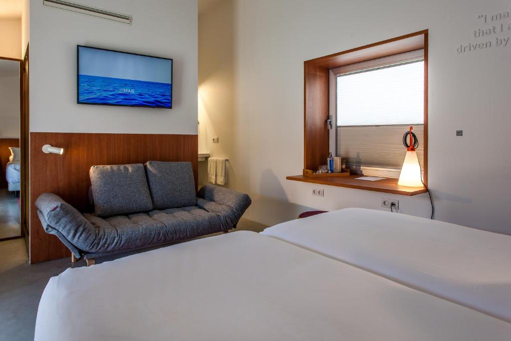 Cama o camas de una habitación en Hotel Bela Fisterra