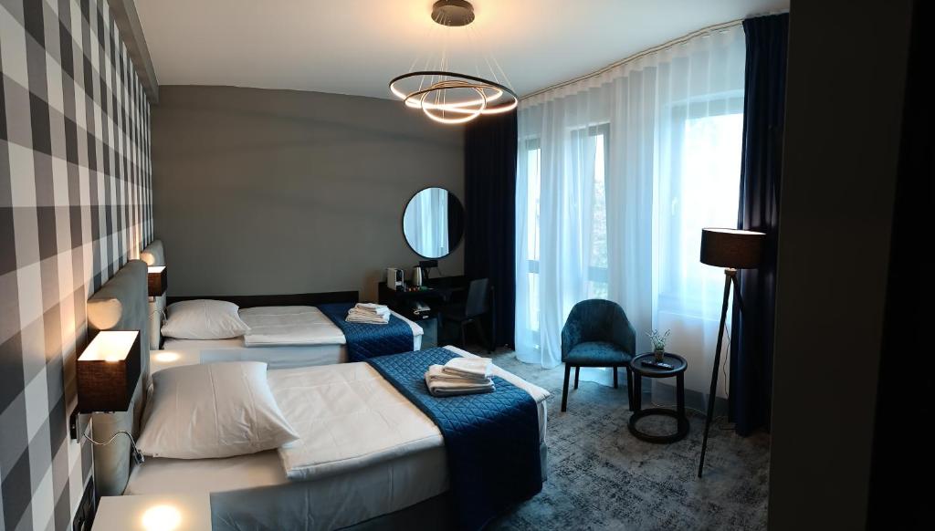 Postel nebo postele na pokoji v ubytování Hotel Sanova