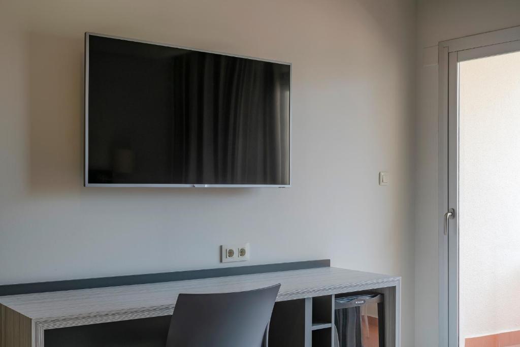 TV a/nebo společenská místnost v ubytování Hotel Los Robles