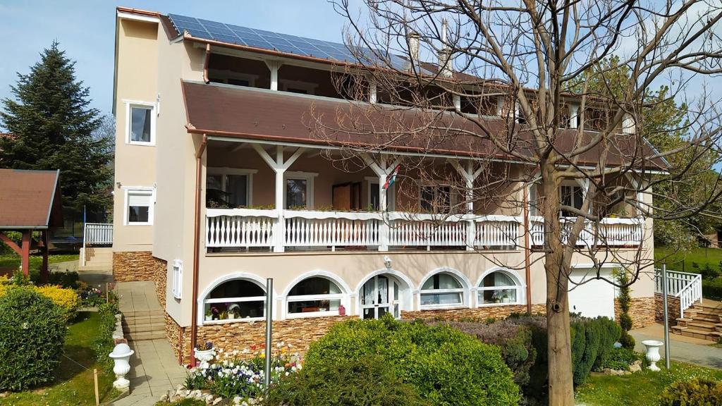 a house with a solar panel on top of it at Németh Apartmanok in Zalakaros