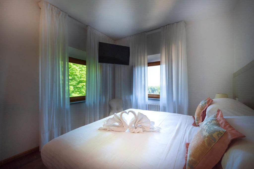 Postel nebo postele na pokoji v ubytování Villa Scacciapensieri Boutique Hotel