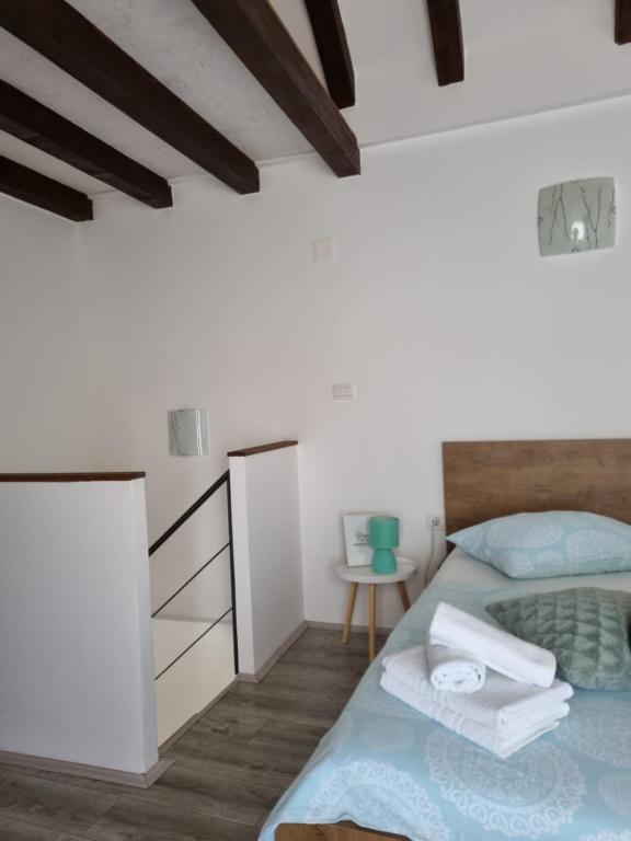 Posteľ alebo postele v izbe v ubytovaní Apartment LELA