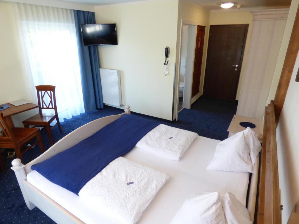Postel nebo postele na pokoji v ubytování Panoramahotel