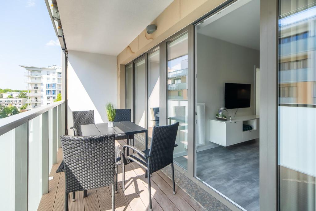 Televízia a/alebo spoločenská miestnosť v ubytovaní Green Sea Apartamenty Kasprowicza