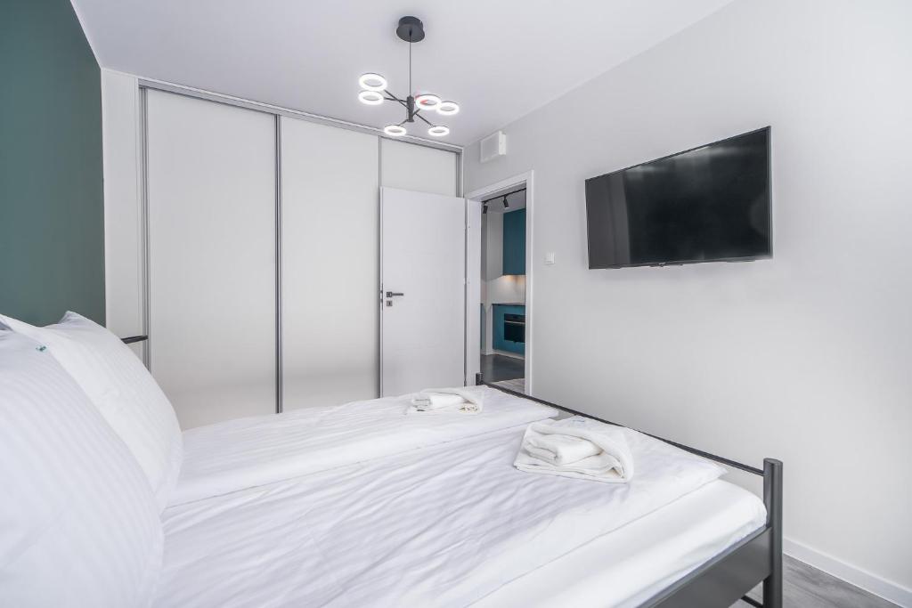 Posteľ alebo postele v izbe v ubytovaní Green Sea Apartamenty Kasprowicza