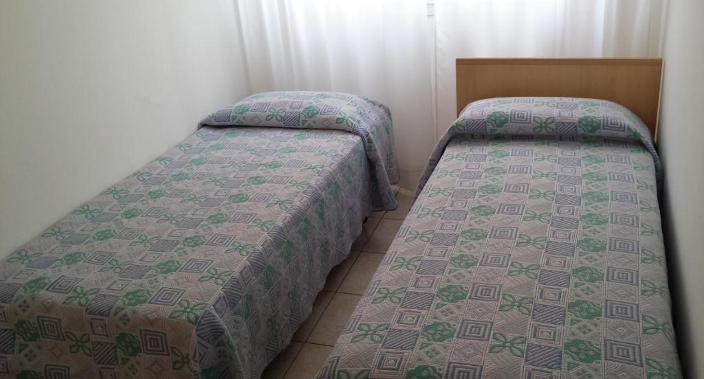 Letto o letti in una camera di Residence Capinera