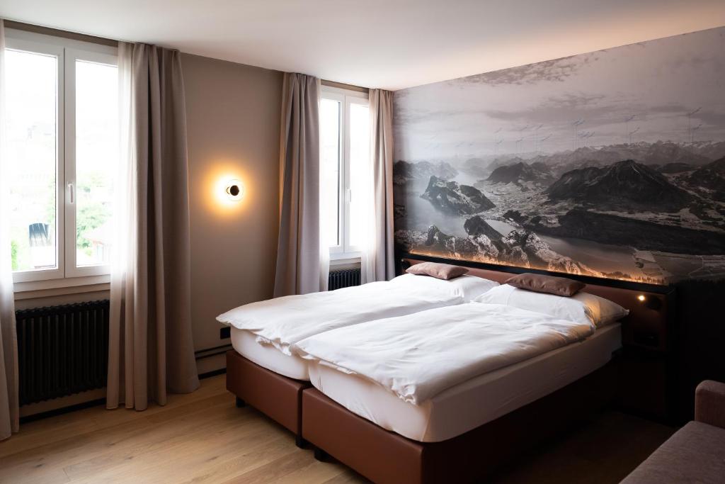 Postel nebo postele na pokoji v ubytování Boutique Hotel Stanserhof
