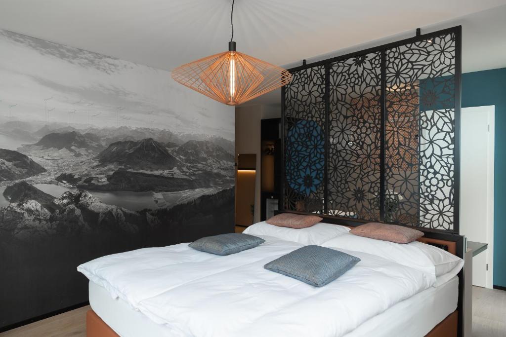 Postel nebo postele na pokoji v ubytování Boutique Hotel Stanserhof