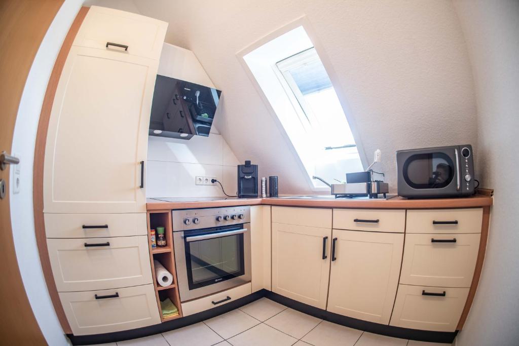 Kuchyň nebo kuchyňský kout v ubytování CityApartments Residence klimatisiert