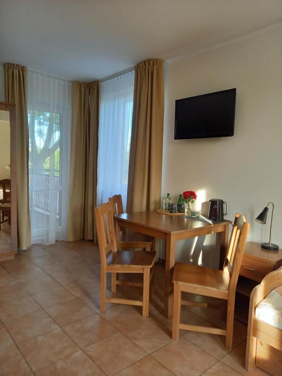 Telewizja i/lub zestaw kina domowego w obiekcie Planeta Apartment Mielno