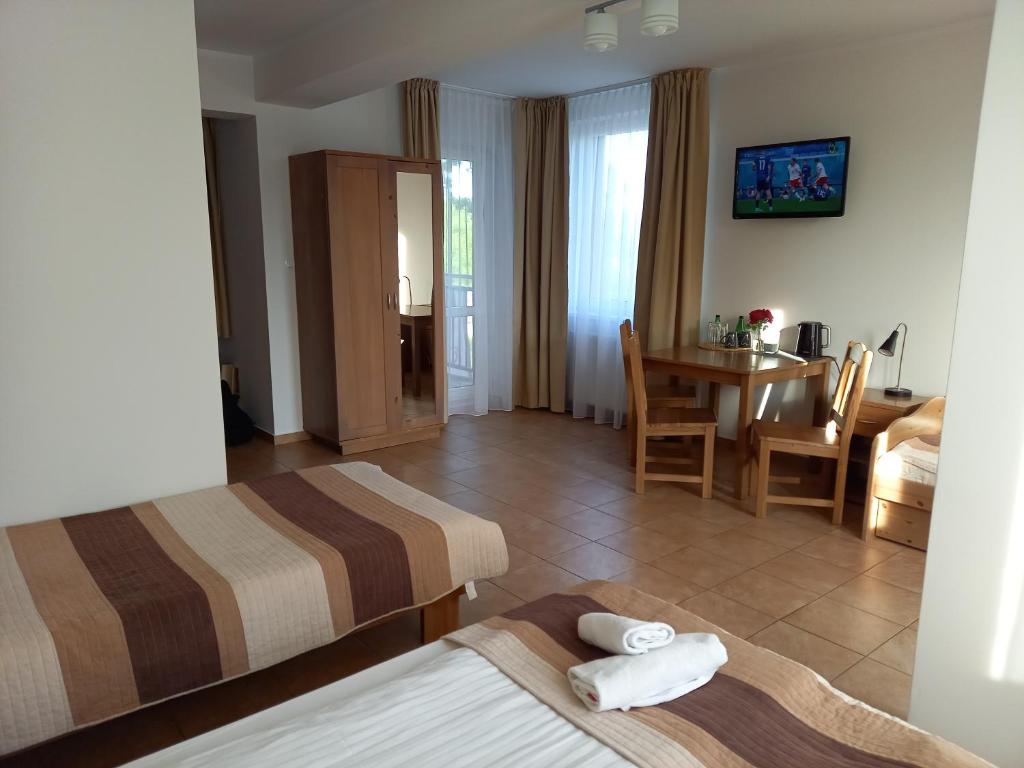 Łóżko lub łóżka w pokoju w obiekcie Planeta Apartment Mielno