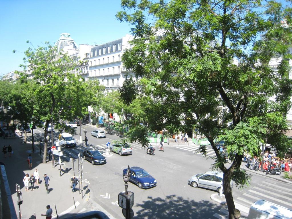 a view of a city street with cars on the road at Studio Bonne Nouvelle in Paris