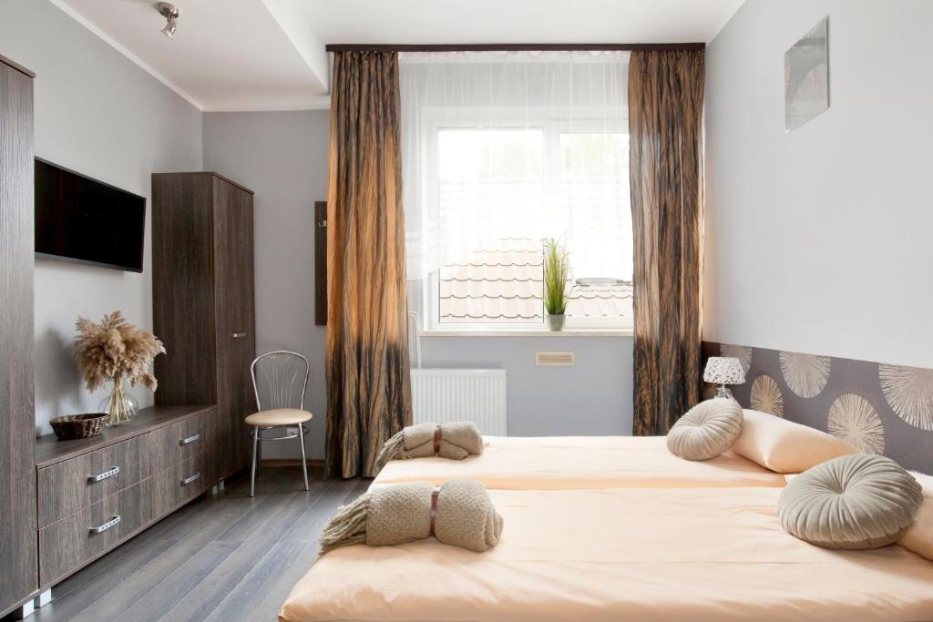 Posteľ alebo postele v izbe v ubytovaní Guesthouse Baltic
