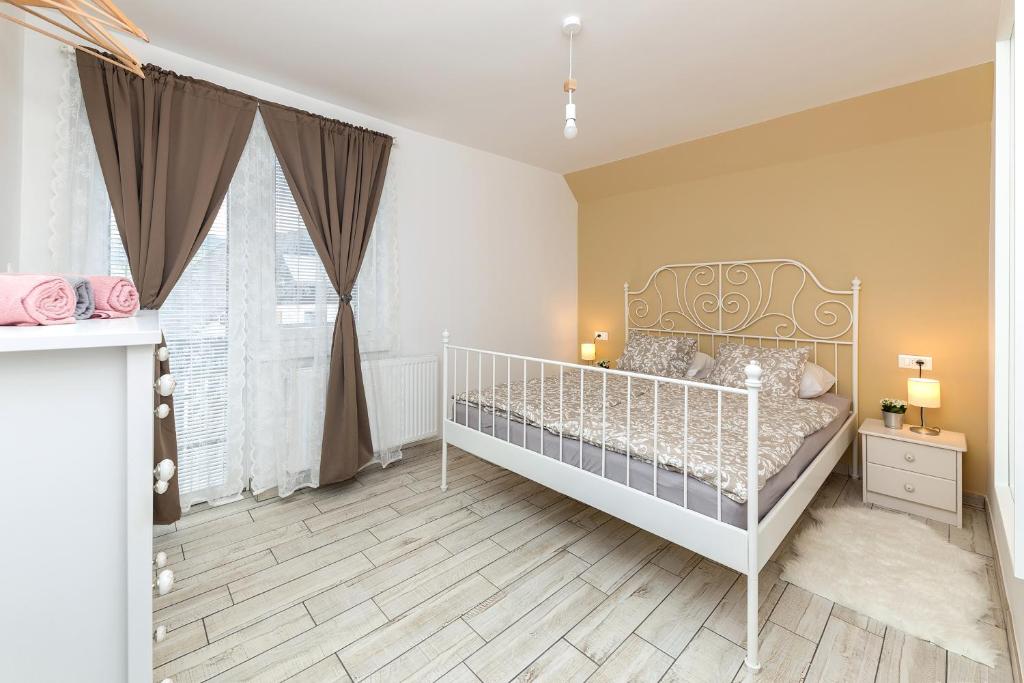 Postel nebo postele na pokoji v ubytování Pod Koblo Bohinj Apartments