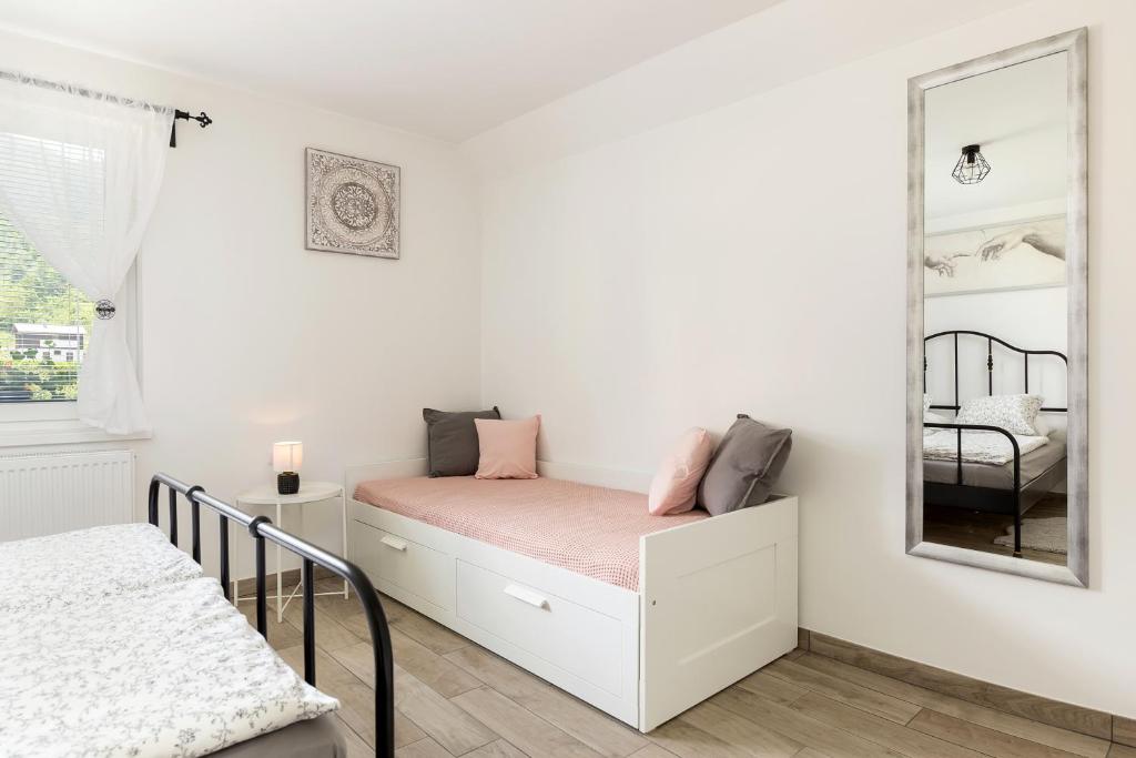 Postel nebo postele na pokoji v ubytování Pod Koblo Bohinj Apartments