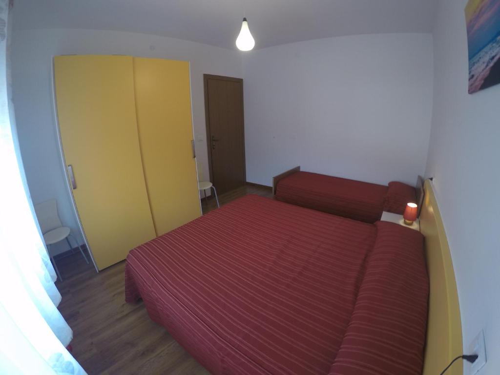 Postel nebo postele na pokoji v ubytování Residence Caorle Apartments - Agenzia Cocal