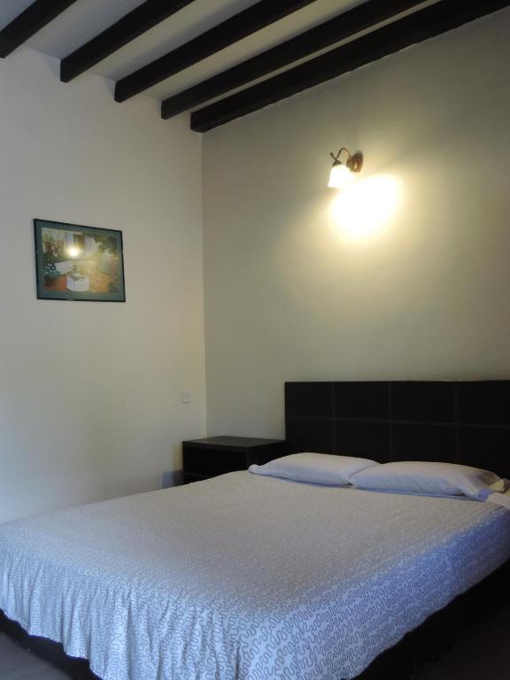 Postel nebo postele na pokoji v ubytování Cameronian Inn