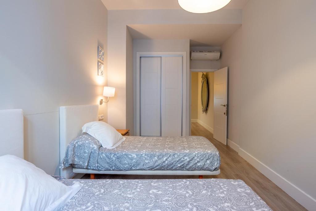 Posteľ alebo postele v izbe v ubytovaní Urbe10 Angel Suites 2 Bedrooms Apartment 2A