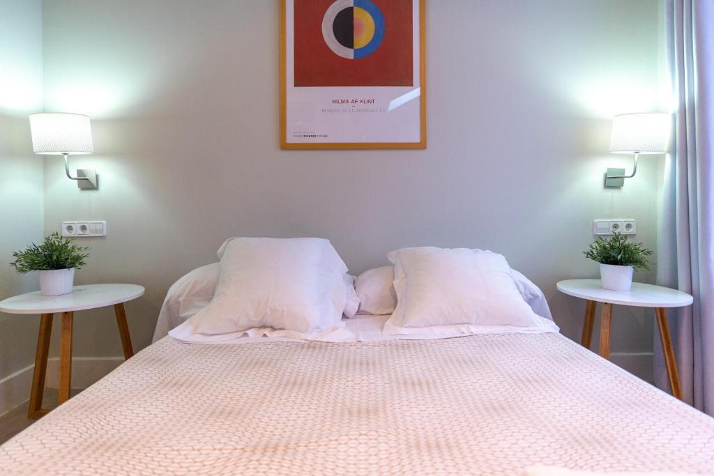 Postel nebo postele na pokoji v ubytování Urbe10 Angel Suites Apartment 4B